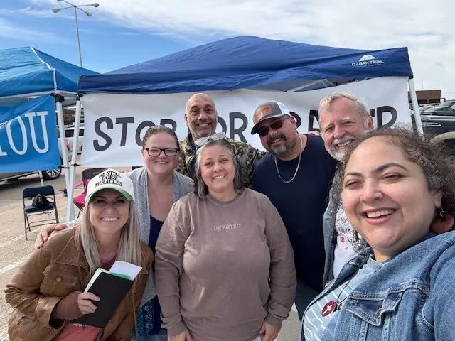Melissa with a group at an outreach prayer tent
